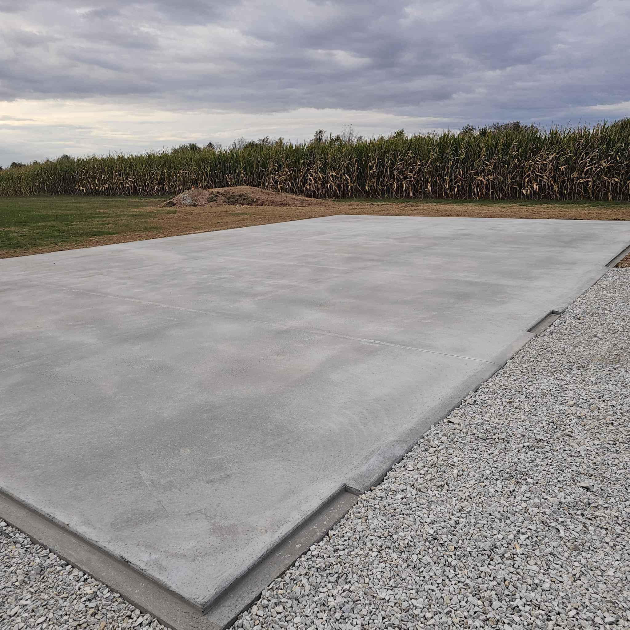 Metal building base rail and concrete foundation corner detail